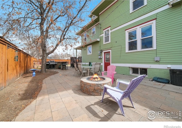 view of patio / terrace featuring a fire pit