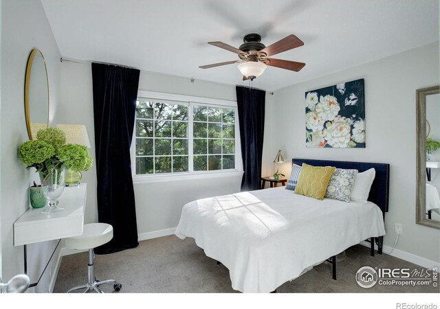 bedroom with ceiling fan and carpet flooring