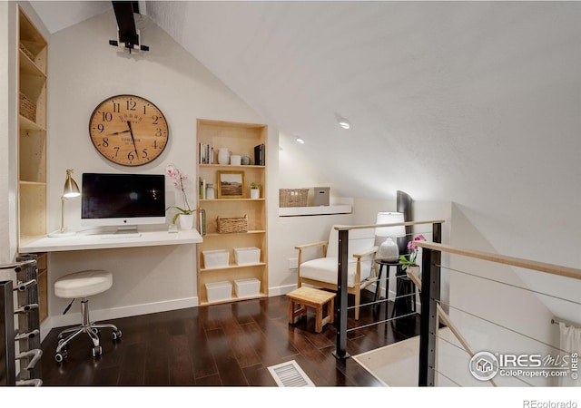 office with vaulted ceiling and dark hardwood / wood-style floors