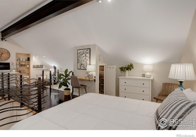 bedroom with lofted ceiling with beams and dark wood-type flooring