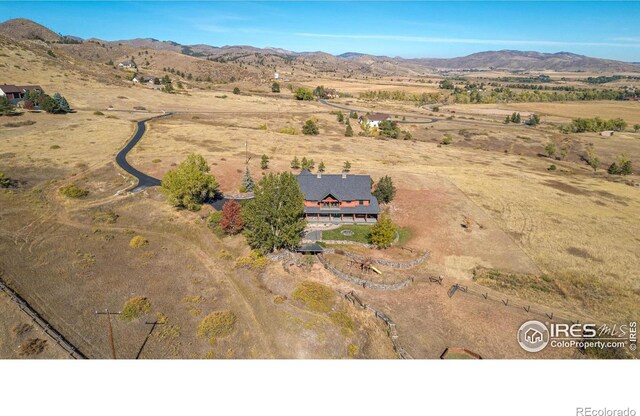 bird's eye view with a mountain view and a rural view