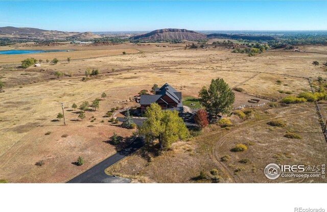 aerial view featuring a rural view and a mountain view