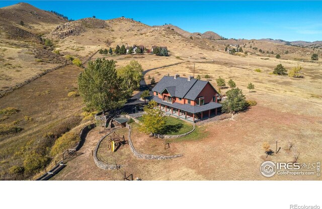 bird's eye view with a mountain view and a rural view