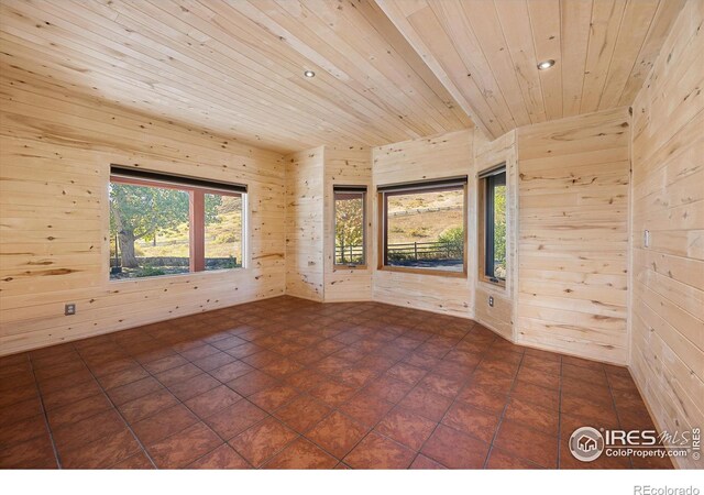 tiled empty room with wood walls and wood ceiling