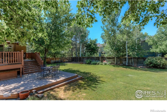 view of yard with a wooden deck