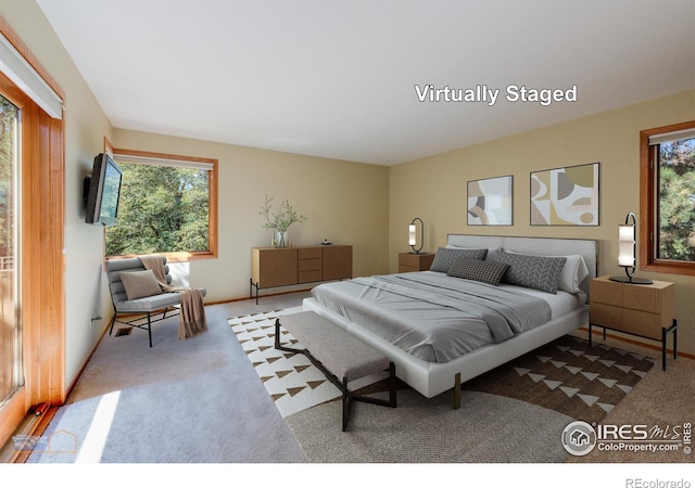 bedroom featuring light colored carpet