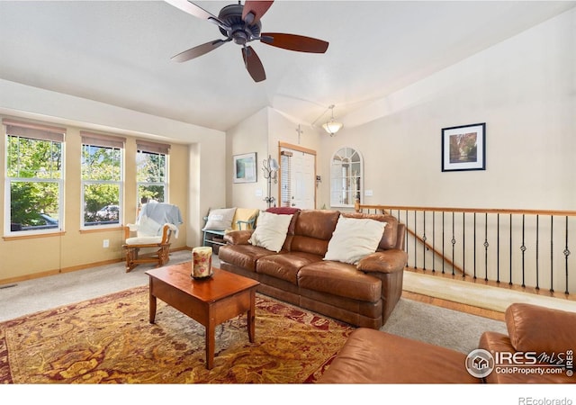 living room featuring carpet flooring, ceiling fan, and lofted ceiling