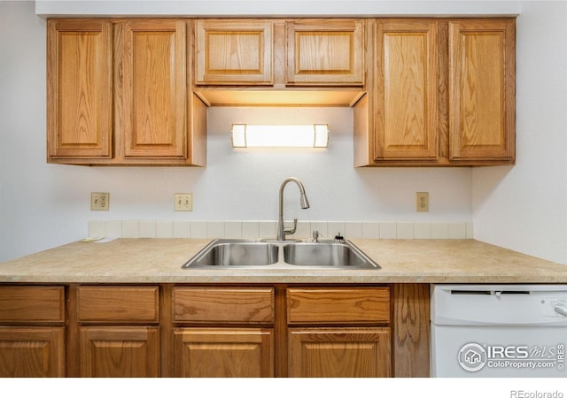 kitchen with white dishwasher and sink