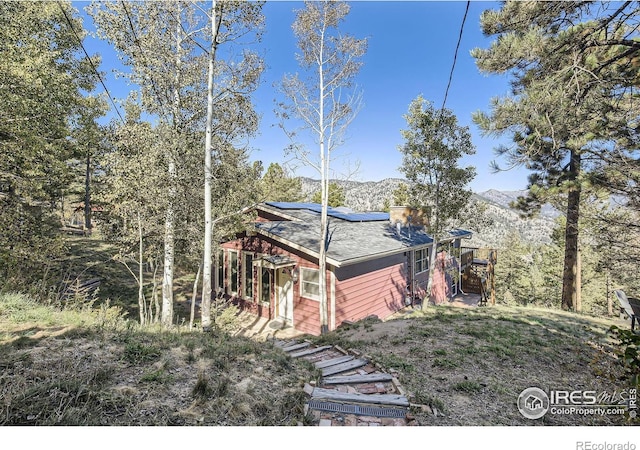 view of front of home with a mountain view