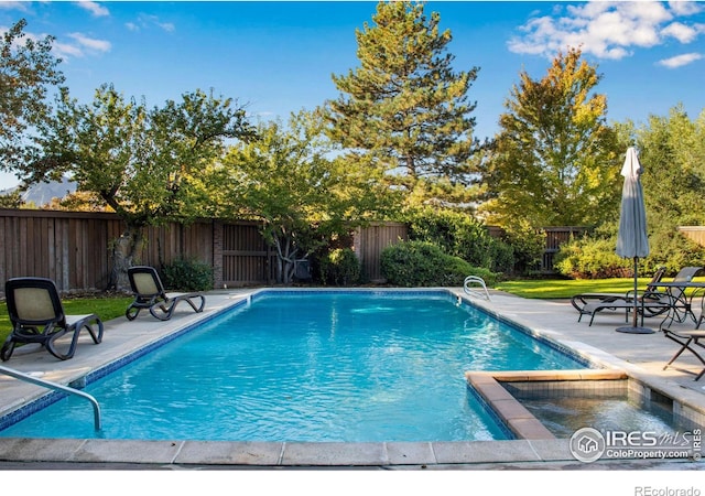 view of pool featuring a patio