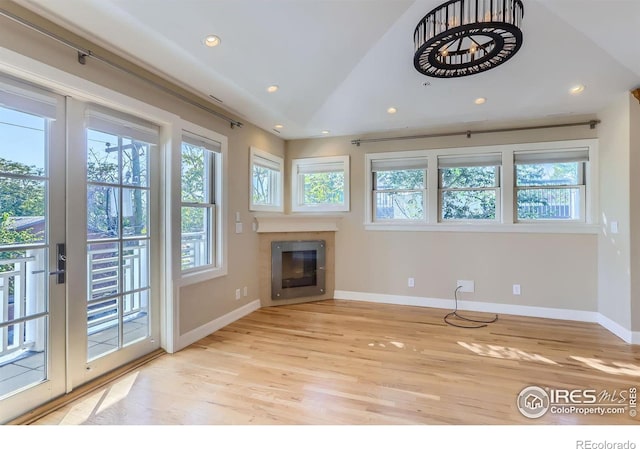 unfurnished living room with light hardwood / wood-style flooring and plenty of natural light