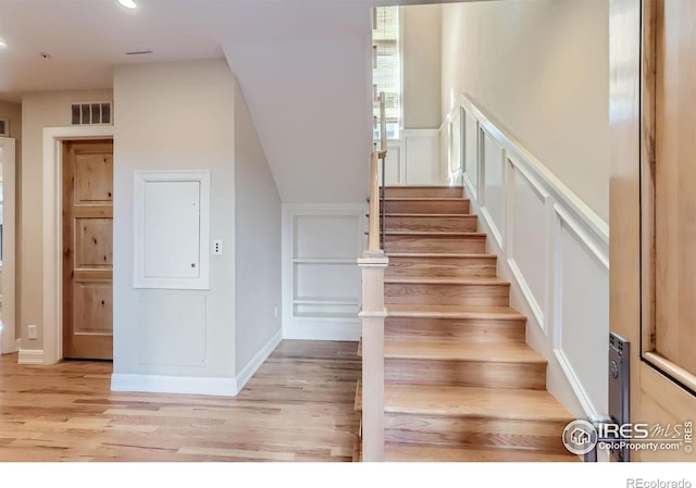 stairway featuring hardwood / wood-style flooring