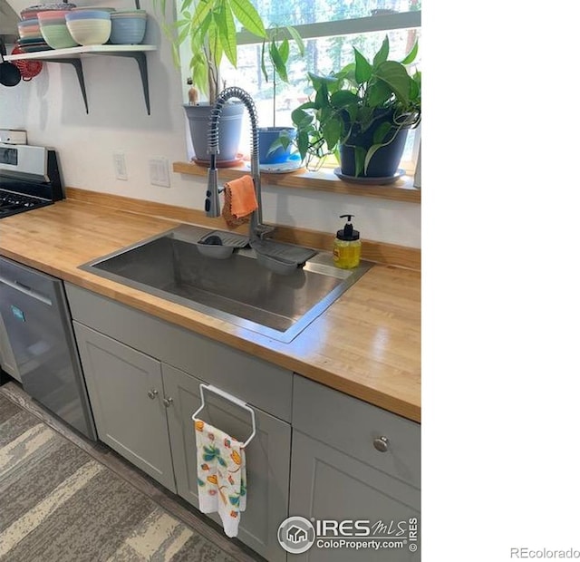 272 Severance Lodge Rd, Black Hawk, CO 80422 - kitchen featuring open shelves, wood counters, and stainless steel appliances