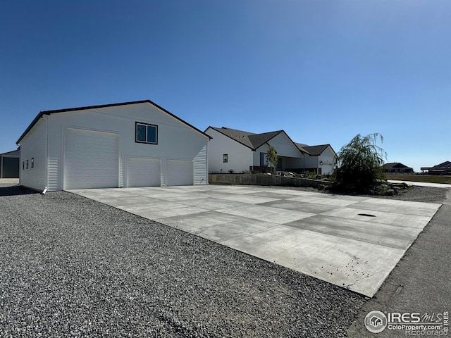 3643 Crested Owl Ct, Dacono, CO 80514 - view of front facade with an outdoor structure, fence, and driveway