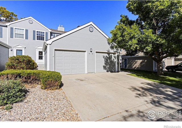 front of property with a garage