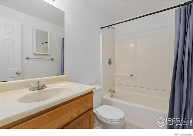 full bathroom featuring tile patterned flooring, vanity, shower / tub combo, and toilet