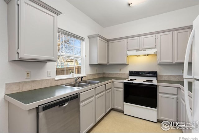 kitchen with gray cabinets, white appliances, and sink