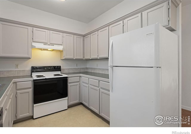 kitchen with gray cabinets and white appliances