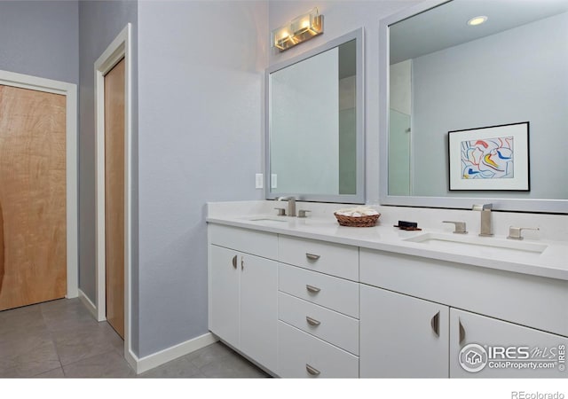 bathroom featuring vanity and tile patterned flooring