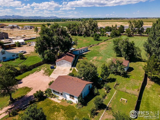 birds eye view of property featuring a mountain view and a rural view