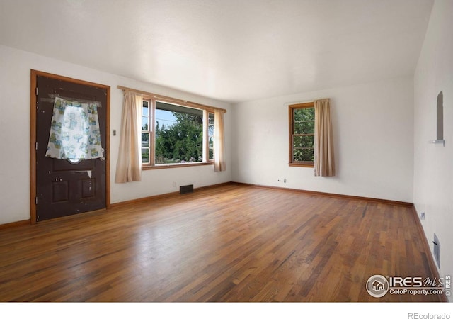 foyer with dark wood-type flooring