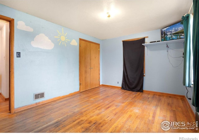 empty room featuring hardwood / wood-style floors