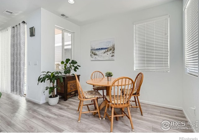 dining space featuring light hardwood / wood-style flooring