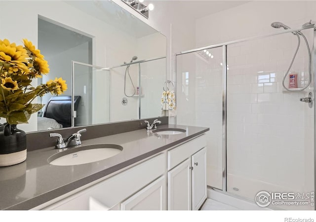 bathroom with walk in shower and vanity