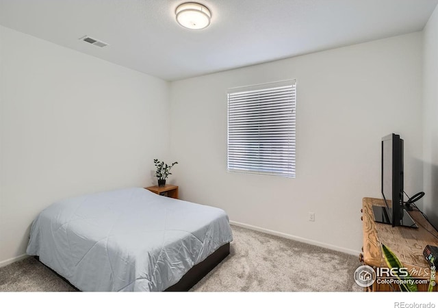 bedroom with light carpet