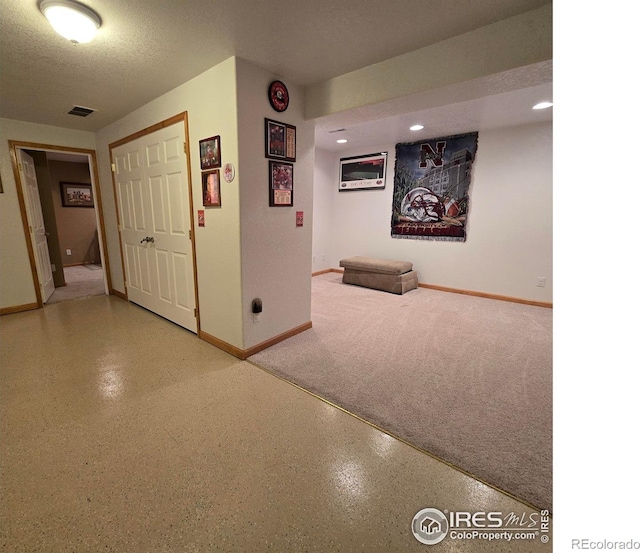 interior space featuring a textured ceiling