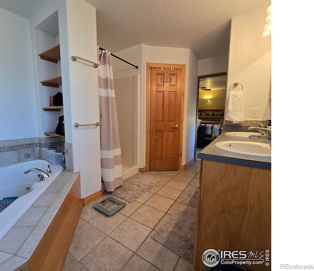 bathroom with vanity, shower with separate bathtub, and tile patterned flooring