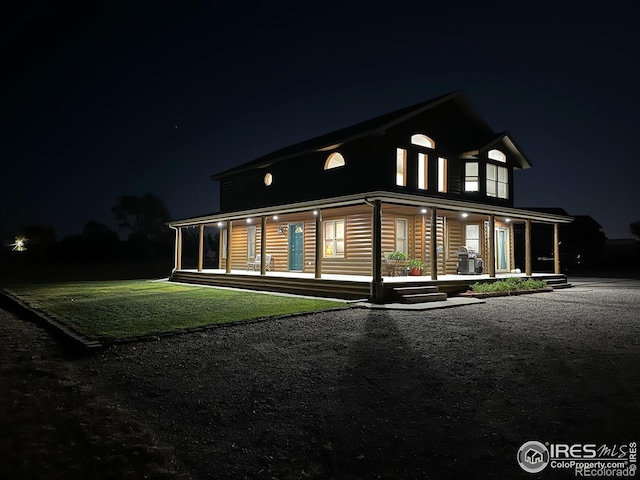 exterior space with a yard and covered porch