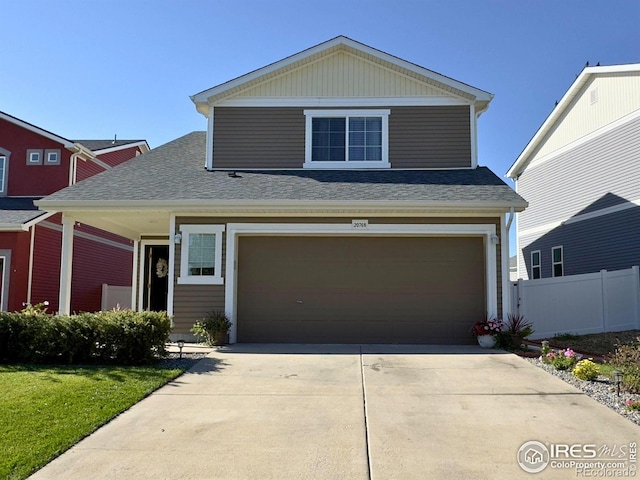 view of front property featuring a garage and a front yard