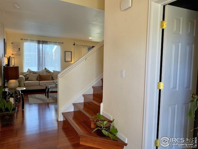 staircase featuring hardwood / wood-style flooring