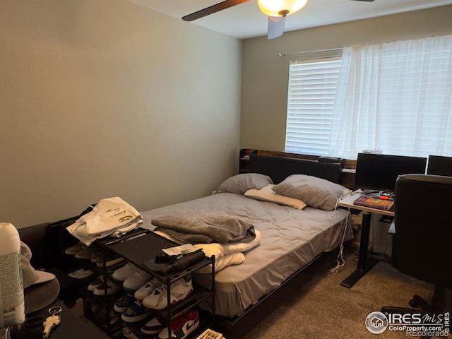 carpeted bedroom with ceiling fan