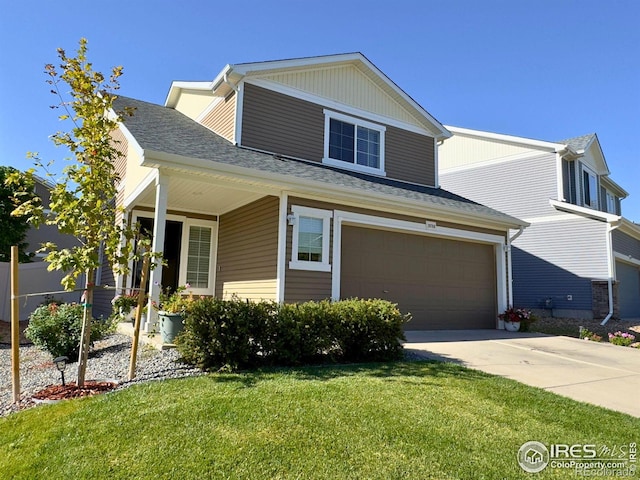 view of front of home with a front lawn and a garage