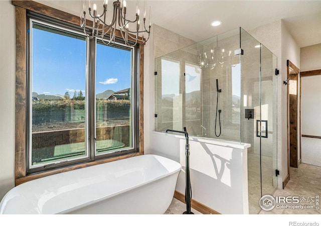 bathroom with separate shower and tub, a chandelier, and tile patterned floors