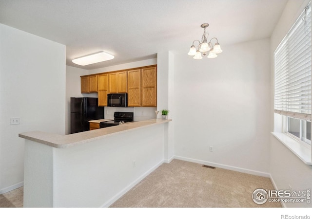 kitchen featuring hanging light fixtures, kitchen peninsula, black appliances, an inviting chandelier, and light colored carpet