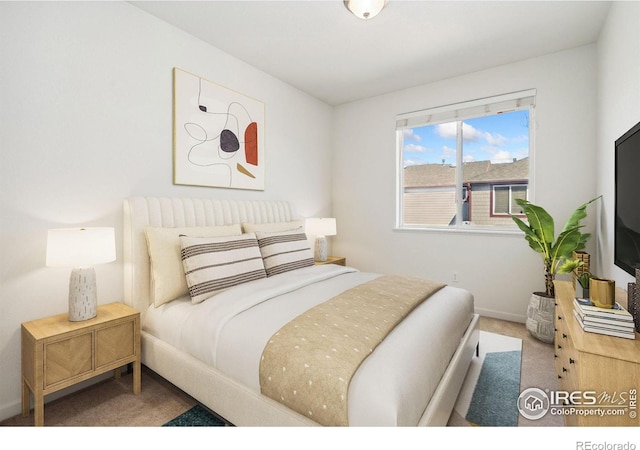 bedroom featuring light colored carpet