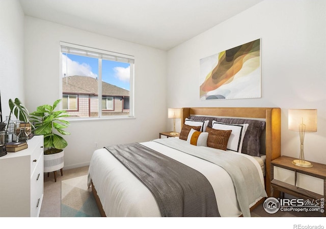 bedroom with light colored carpet