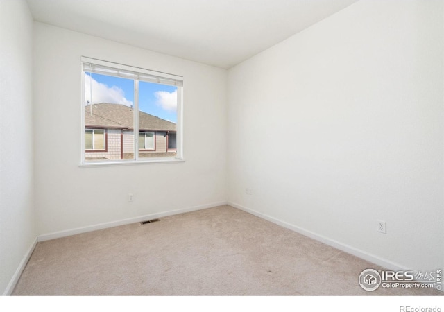 view of carpeted spare room