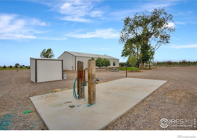 view of patio / terrace with a storage unit