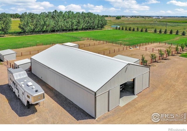 birds eye view of property featuring a rural view