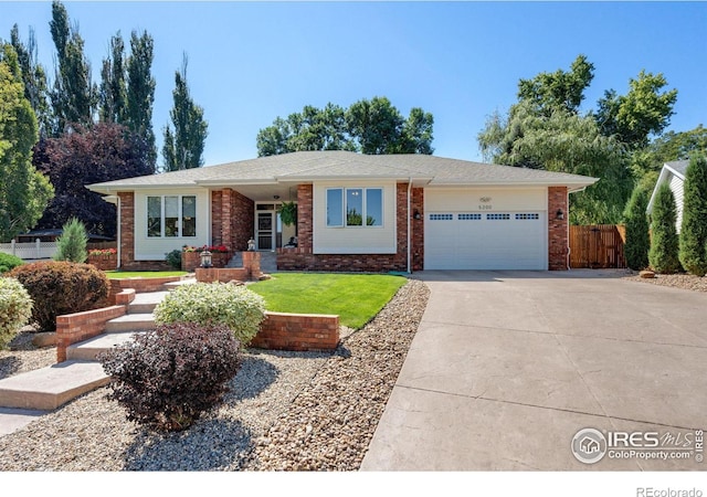 single story home featuring a garage and a front lawn