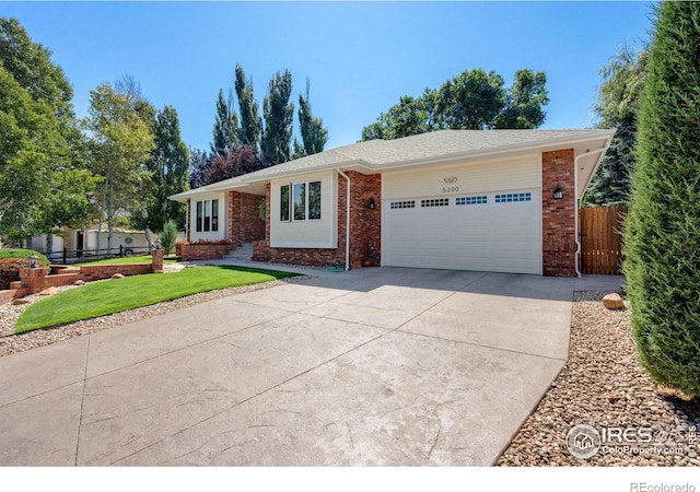 ranch-style house featuring a garage and a front lawn