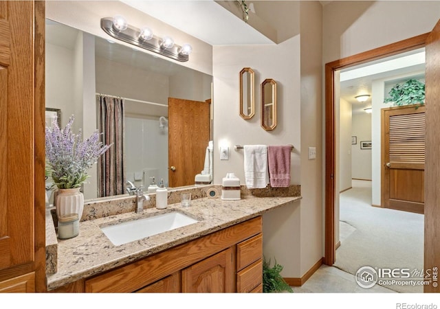 bathroom with vanity and a shower with curtain