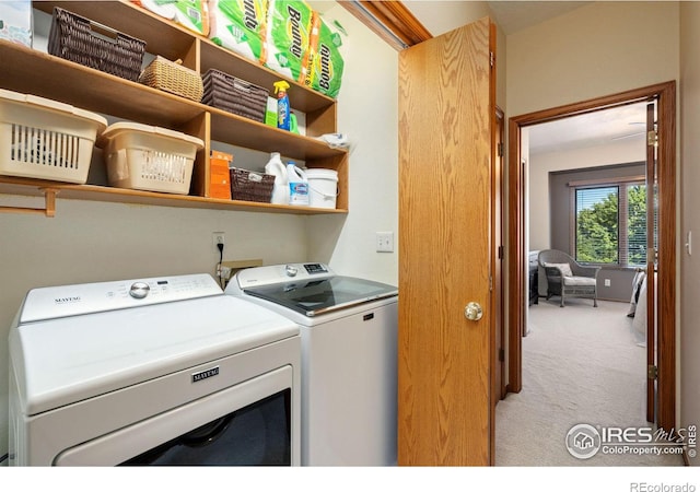 laundry area featuring light colored carpet and independent washer and dryer