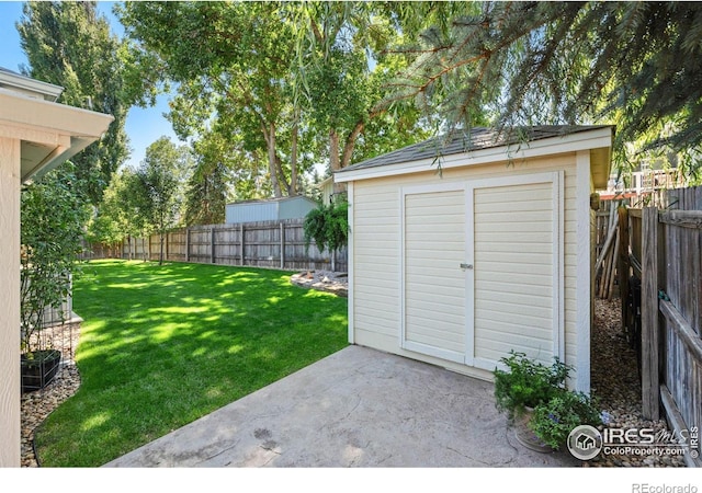 view of outbuilding with a yard