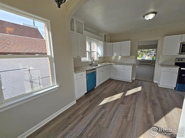 kitchen featuring electric stove, dishwasher, white cabinets, and stainless steel microwave