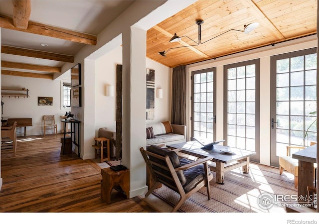 dining area with vaulted ceiling with beams, wood ceiling, and hardwood / wood-style flooring